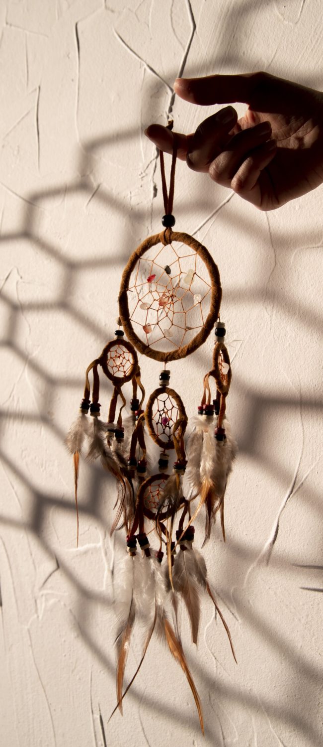 dreamcatcher-held-by-hand-sun
